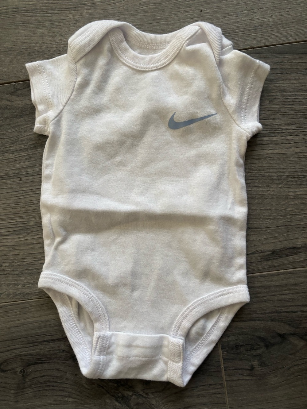 Nike White Baby Bodysuit with Gray Swoosh